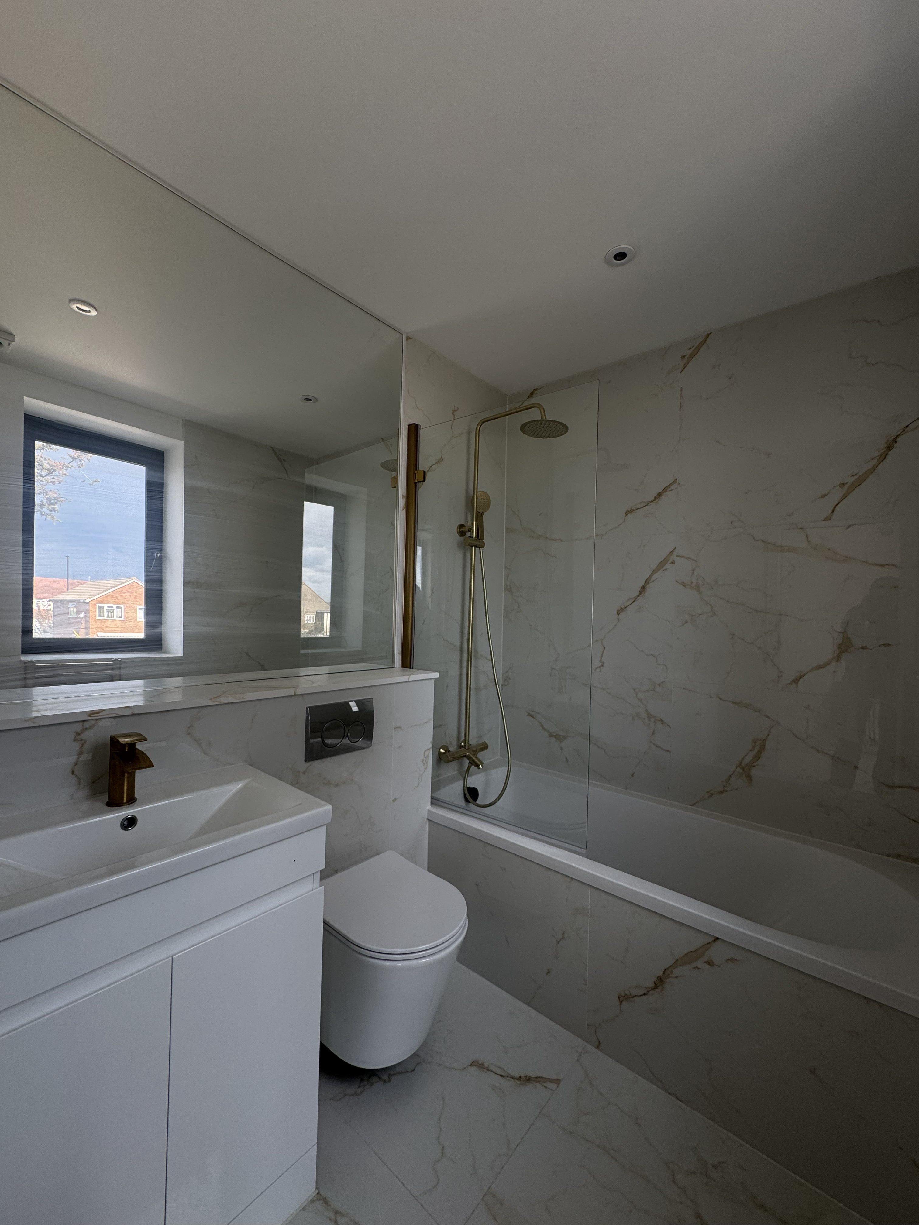 Bathroom tiling and gold fittings
